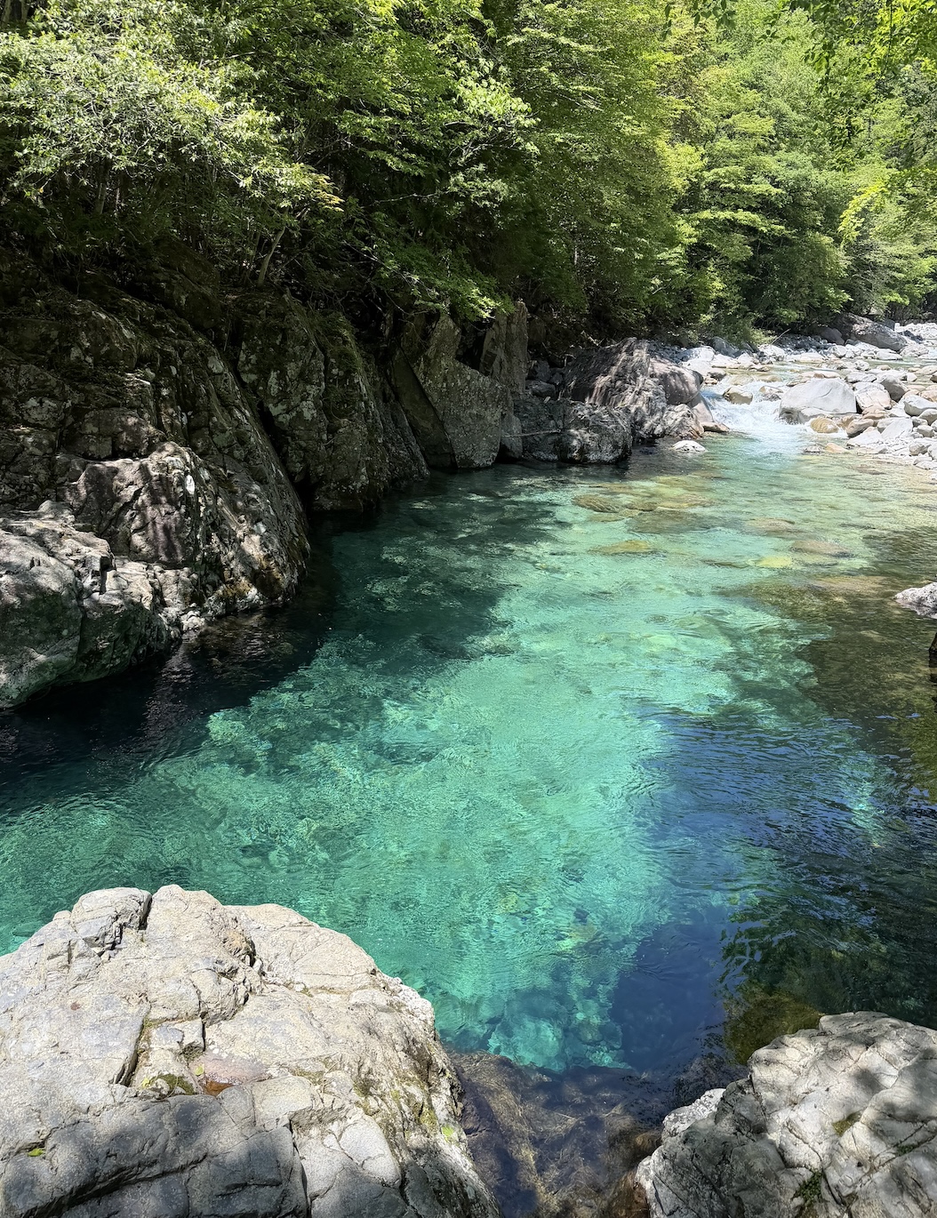 Atera Valley emerald-green water and forest scenery